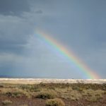 Photo of rainbow above the desert