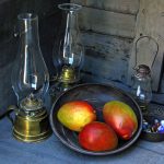 Photo of mangos, iron dishes, marbles, hurricane lamps