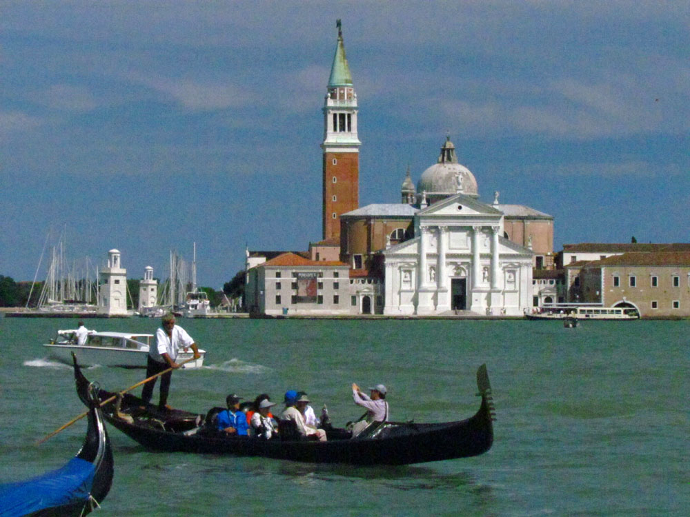 Photo of gondola rowing through Venice